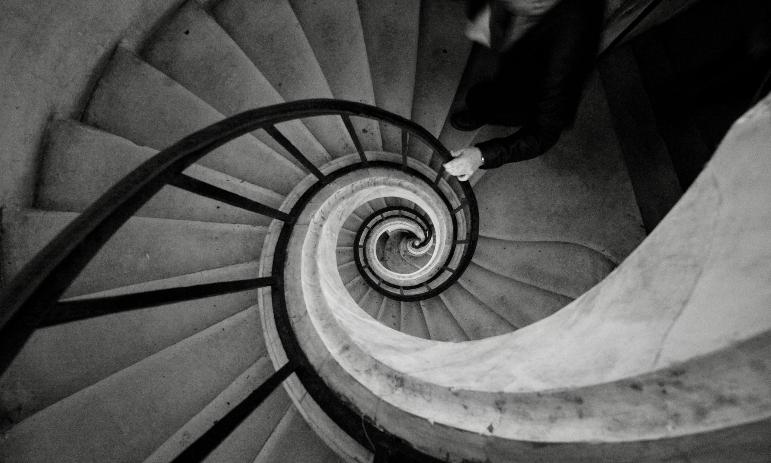 Black and white spiral staircase viewed from above